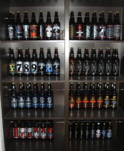 A lineup of Stone Brewing Company beer bottles