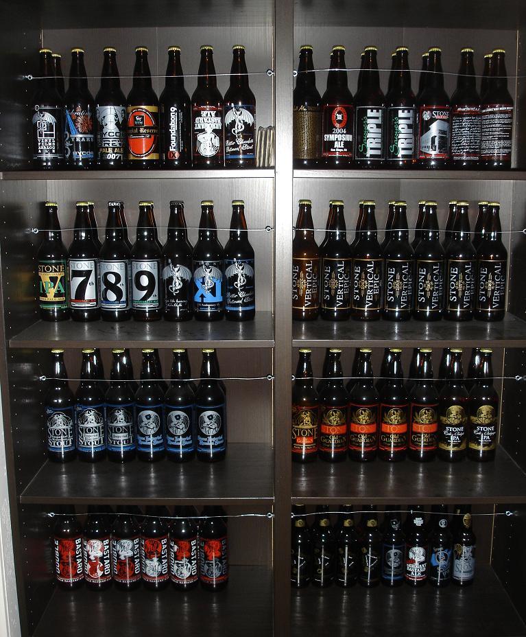 A lineup of Stone Brewing Company beer bottles